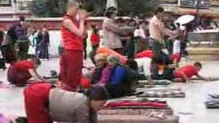 Pilgrims prostrating at Jokhang temple Lhasa Tibet [upl. by Waddington660]