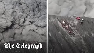 Moment climbers run for their lives as volcano erupts in Indonesia [upl. by Kimber]