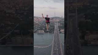 Estonian man walks a slackline set up on Istanbuls Bosphorus Bridge in Turkey [upl. by Niriam249]