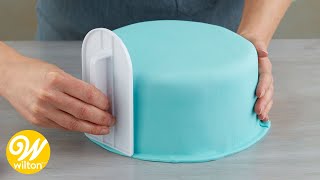 How to Cover a Round Cake with Fondant  Wilton [upl. by Eilla]