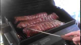 Turning Ribs on the Grill with Mathews Design Original BBQ Hook [upl. by Gayel]