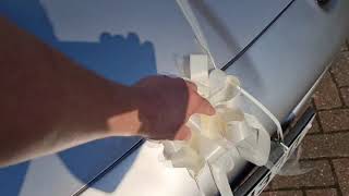 Fitting wedding ribbons to a car Jaguar XK8 in this case [upl. by Estella]