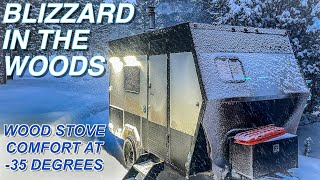 WINTER CAMPING During A BLIZZARD  Wood Stove for Heat  Stuck in Snow with my DIY Travel Trailer [upl. by Noyerb]