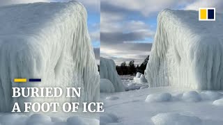 Shop along Lake Michigan frozen in ice after deadly US blizzard [upl. by Ewnihc121]