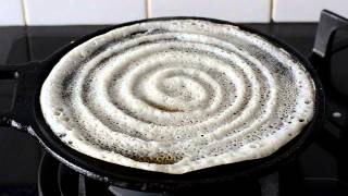 Spreading Dosa over iron tawa [upl. by Semreh]