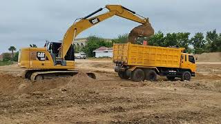 powerfull caterpillar on working digging and loading dirt to big truck [upl. by Enneirdna]