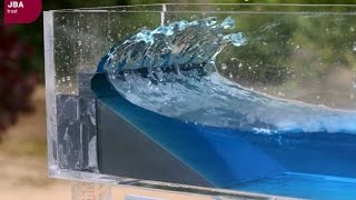 Wave tank demonstration showing the impact of coastal defences on flood risk [upl. by Anerroc690]