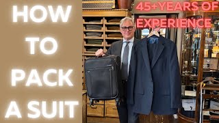 How to pack a suit in a suitcase [upl. by Ailadi]