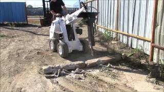 RAMROD Mini Skid Loader 950 with Hydraulic Hammer Attachment [upl. by Jenkel]