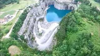 UAVDrone Views of Atlantas Bellwood Quarry City Skyline in Background [upl. by Rorie]