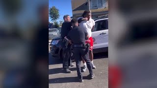 LAPD officer punches handcuffed man during arrest in Watts [upl. by Portugal461]