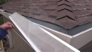 Installing gutter guards on an asphalt shingle roof [upl. by Baillieu712]