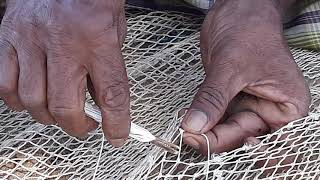 Primative techniques of repairing fishing nets [upl. by Ecinue]