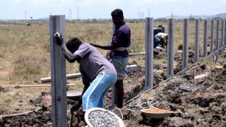 Erecting a concrete fencing posts [upl. by Acissej273]