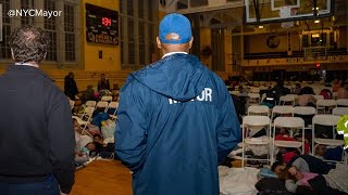 Migrants head back to Floyd Bennett Field after night on school gymnasium floor [upl. by Ardnahs]