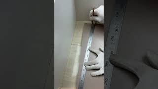 The process of measuring and installing wooden floor tiles in an uneven corner [upl. by Hebe]