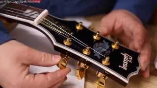 A Guitar Builder Looks at a Chinese made FAKE Gibson Supreme Chibson Guitar [upl. by Urbannal]