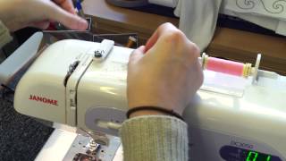 How to wind a bobbin and thread a Janome DC3050 sewing machine [upl. by Durwood]