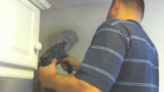 Using a huge drill bit to cut a cylindrical hole through the wall for my boilers flue pipe [upl. by Antonietta]