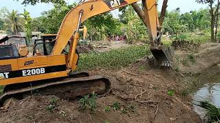 Cat E200B excavator working canal [upl. by Eilasor]