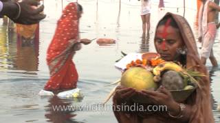 People gathering on a river bank for Chhath Puja [upl. by Lipson]