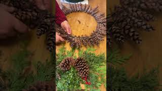 Making a pine cone wreath Merry Christmas gardens diy [upl. by Ojillib]