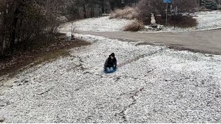 Sledding down a hill in new snow [upl. by Ahsenot]