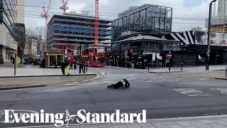 Pedestrians fall over in strong winds as Storm Eunice hits the UK [upl. by Wilen]