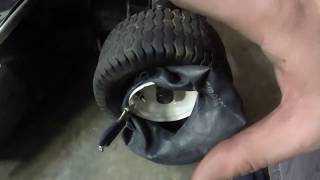 Installing riding mower inner tube using basic tools without taking the tire off [upl. by Anolahs]