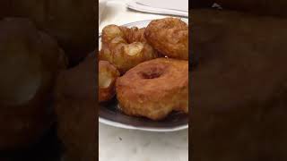 Trying sfenj Moroccan doughnuts  Marrakech street food tour [upl. by Kuth]