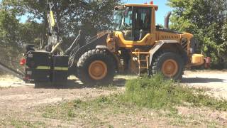 Volvo L70F wheel loader clearing bushes in a ditch in 2013 [upl. by Nnodnarb215]