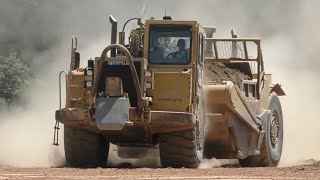 Caterpillar Scrapers Moving Dirt Around [upl. by Airottiv511]