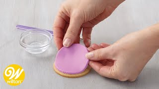 How to Apply Fondant Decorations on Cakes and Other Desserts  Wilton [upl. by Ute206]