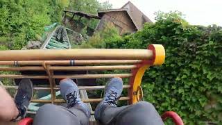 Gsengte Sau bobsled coaster at Tripsdrill in Germany Intertwined with building and logflume POV [upl. by Adnohryt]