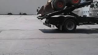 Switch n Go flatbed unloading bobcat [upl. by Jaquiss]