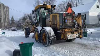 John Deere grader 770G plowing residential streets February 16th [upl. by Adnam]