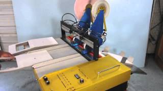 MGL Tape applicator  28 inch wide demonstrated with die cut Cardboard [upl. by Judus963]