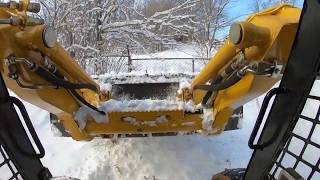 Plowing snow in Iowa with the John Deere 317 [upl. by Elttil953]