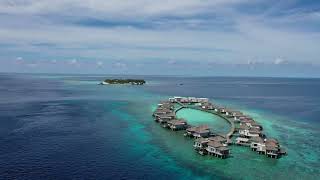 Raffles Maldives Meradhoo Resort  overwater villas enclave  brilliant drop flight aerial views [upl. by Irod128]