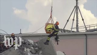 Italy Rescuers work to free bridge collapse victims [upl. by Llener962]