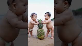 Two babies are playing with a big pineapple [upl. by Kamila]