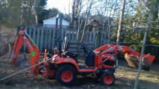 kubota 25 BACKHOE DIGGING POSTHOLES [upl. by Ahcsap]