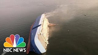 Video Shows Huge Capsized Cargo Ship  NBC News [upl. by Ydnac372]