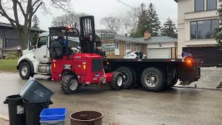 Moffett truck mounted forklift unloading bricks part 2 [upl. by Emerej]