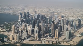 FLYING OVER DOHA SKYLINE  Qatar Airways Boeing 777300ER takeoff from Doha [upl. by Maples]