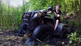 STUCK IN THE MUD amp BREAKING THE WINCH Lifted Polaris Sportsman 800 4x4 OffRoading [upl. by Ardnik]