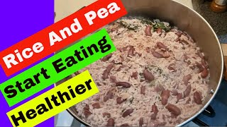 Jamaican Rice And Peas Recipe With Coconut Milk  Bob Marley Favorite Food [upl. by Yeblehs]