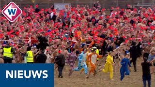 Nieuwjaarsduik 2019 Duizenden rennen naar de zee  OMROEP WEST [upl. by Cardwell387]