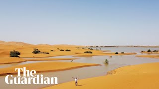 Drone footage shows rare flooding in the Sahara desert [upl. by Ruffina26]