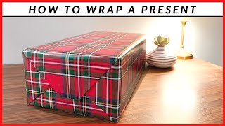 How To Wrap A Present  Simple Wrapping Paper Technique [upl. by Nospmoht]